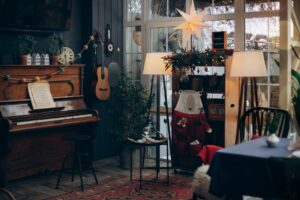living room with piano and christmas decorations