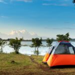 camping dome tent near a body of water