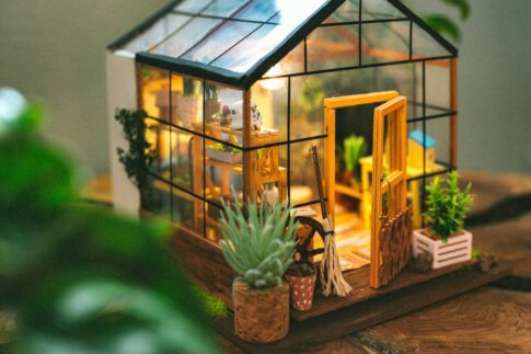 close up photo of a wooden house miniature