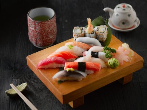 sushi on brown wooden board