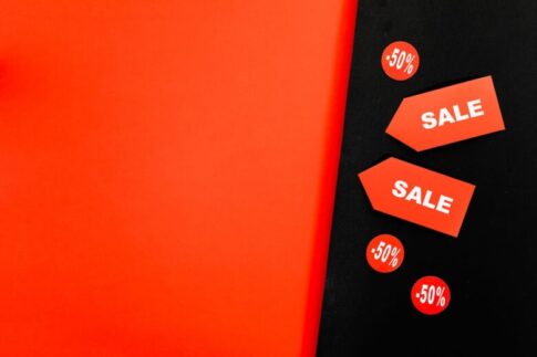 a red sale tags on red and black background