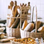 delicious baked bread and buns in baskets