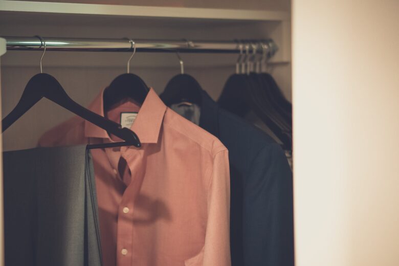 close up photo of hang clothes in wardrobe